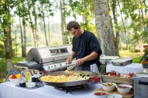 Cook Professional Working in Outdoor Kitchen